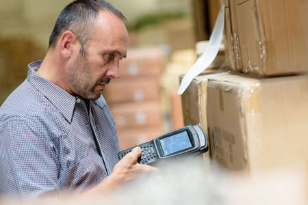 portrait of a man during inventory examinationの写真素材