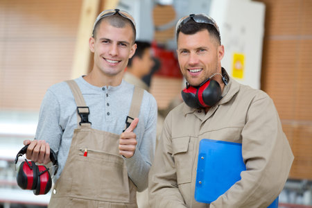 a portrait of two workers