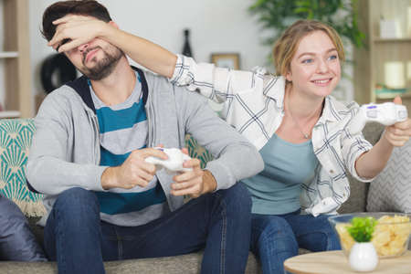 woman closing eyes to girlfriendの写真素材