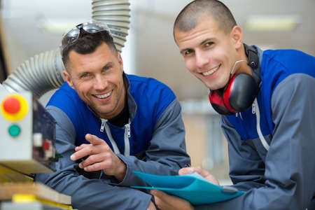 smiling workers looking at the cameraの写真素材