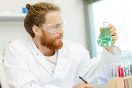 a scientist chemist checking chemicals