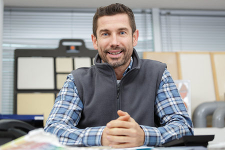 portrait of smiling worker looking at camera
