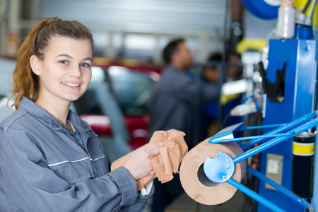 portrait of young female mechanic apprentice