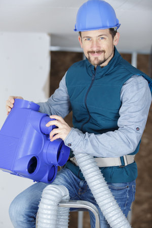 an electrician looking at camera