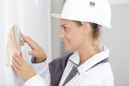 Female construction worker with swatches