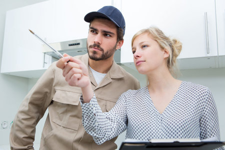 customer pointing at something at home