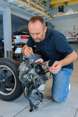 a biker polishing spare part