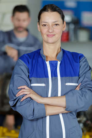 female mechanic looking at cameraの写真素材