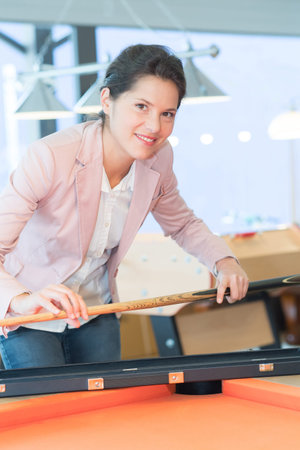 snooker female player on snooker table