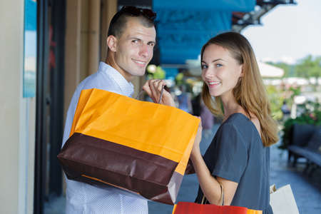 couple doing shopping in a cityの写真素材