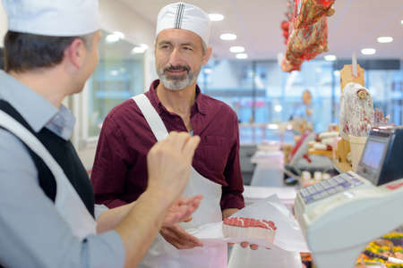 butchers having a conversationの写真素材