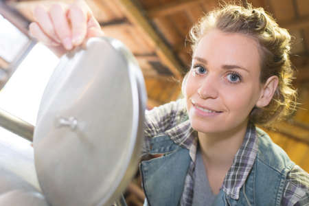 portrait of a woman plumbing connectionの写真素材