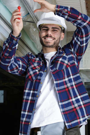 a happy young man workerの写真素材