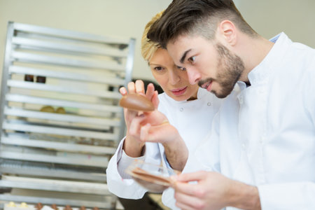 portrait of workers making chocolate