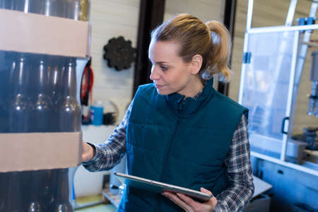 friendly worker during working process at beer brewery factoryの写真素材