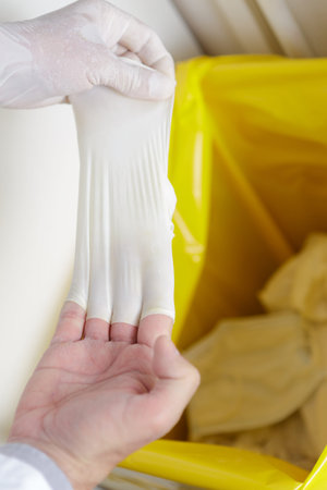 taking off infected gloves