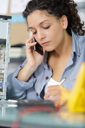woman technician on the phone with customer