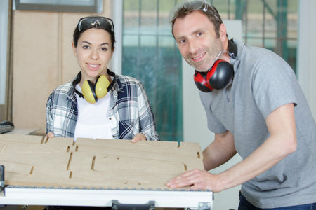 man and woman in wood workshop