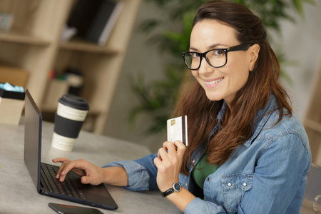 woman buying online while on a credit card