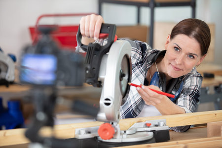 young woman doing a carpentry vlog