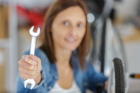young woman with hand toolの写真素材