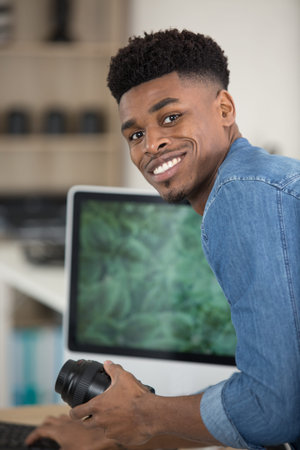 handsome young man looking at camera and smiling