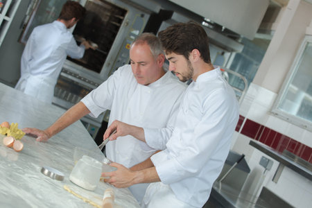 apprentice male pastry chef in training