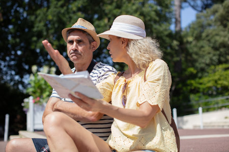 couple sitting together on bench outdoors