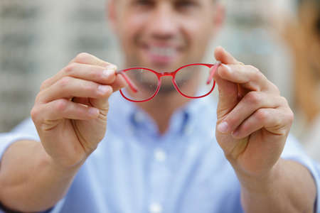 portrait shot of smiling man in glassesの写真素材