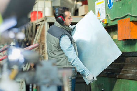 worker on the industrial machineの写真素材
