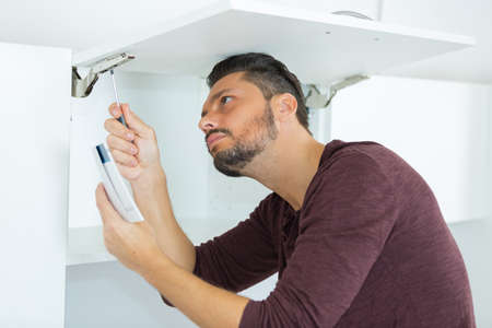 mending cabinet hingeの写真素材