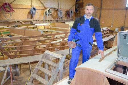 Portrait of carpenter in boat yard