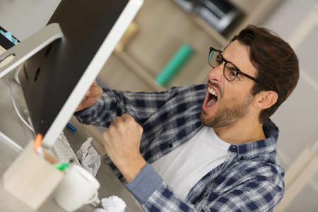 angry and furious in his officeの写真素材