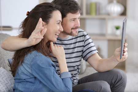 beautiful wife and husband calling thier parent