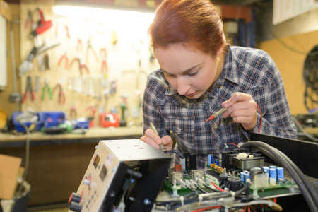 portrait of young electronic technician