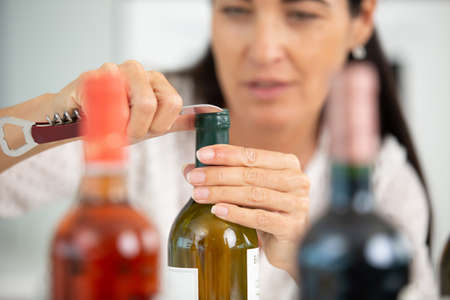 portrait of smiling female wine maker in wine cellarの写真素材