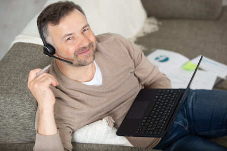 customer support operator with headset working in the office