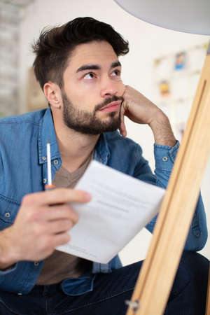 man stucking with assembling furnitureの写真素材
