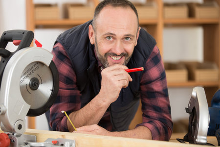 portrait of carpenter smiling at cameraの写真素材