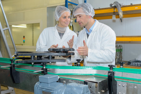 workers in the food production on a machine