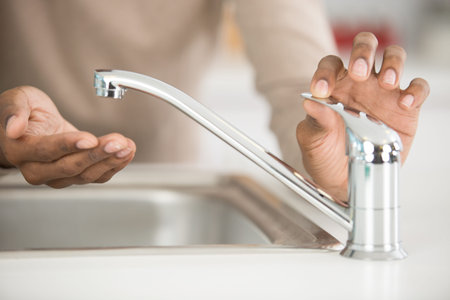 cropped view of woman washing dirty hands