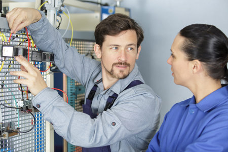 electrician and his apprentice at work