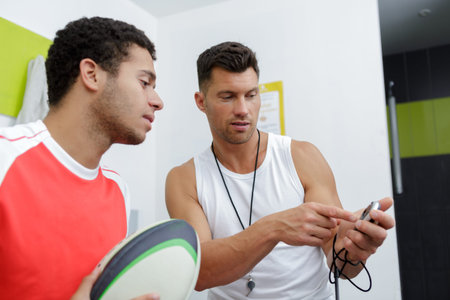 coach talking to a young rugby player