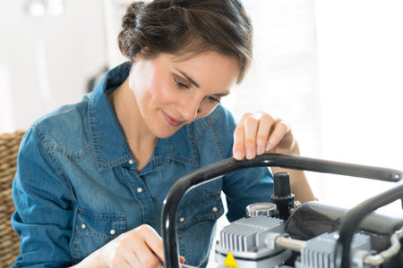 portrait of woman hand fixing engine
