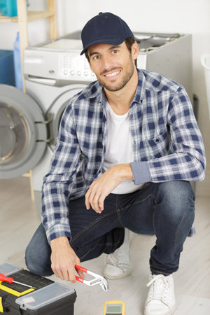 portrait of a smiling repairmanの写真素材