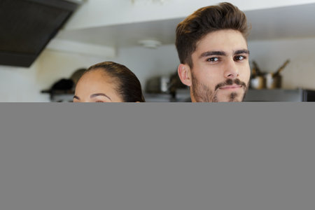 happy young man and woman in chefの写真素材