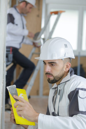 portrait of plasterers at work