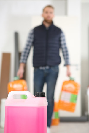 man with cleaning and disinfection productsの写真素材