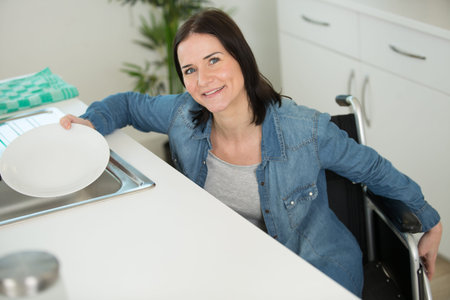 disabled woman doing house choresの写真素材