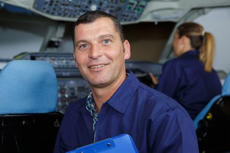 portrait of male engineer in aircraft cockpit